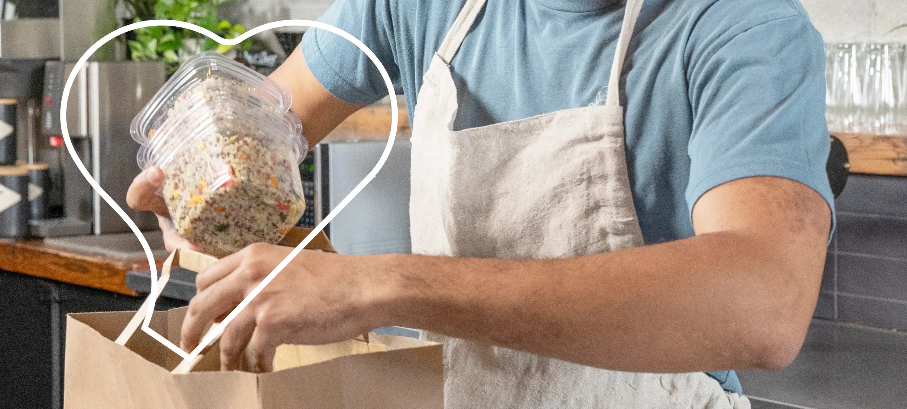 packing up some quinoa salads in deli containers for lunch.