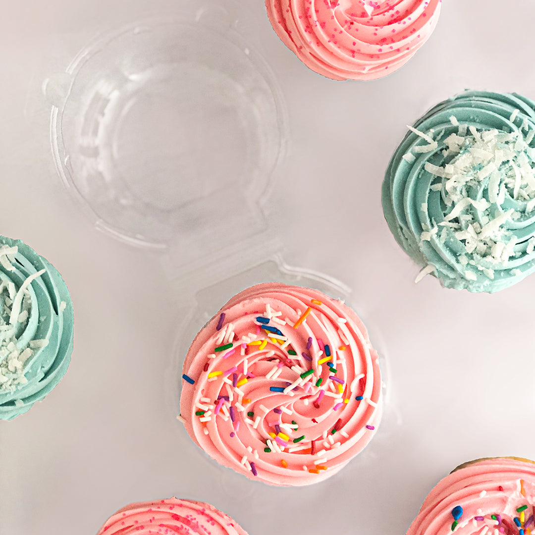 Delcious Cupcakes with Frosting, Spinkles and Coconut.