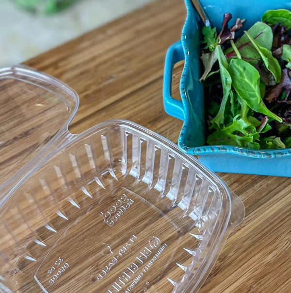 Multipurpose Clamshell Package that held lettuce being transferred to a bowl.