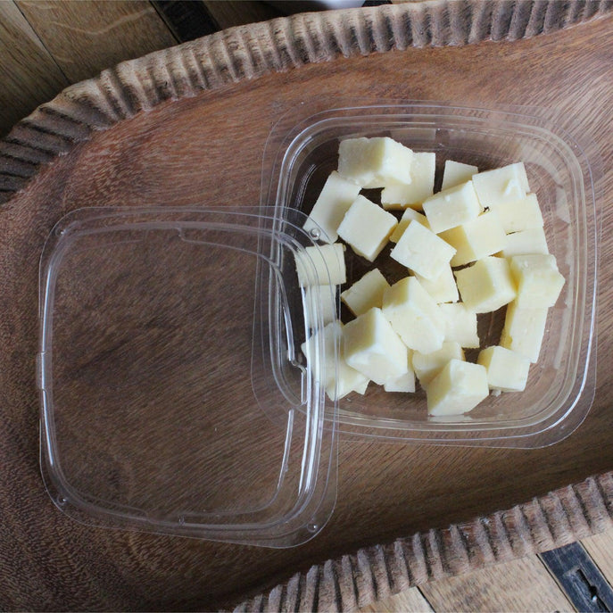 8 oz deli container made of compostable, eco-friendly material containing cheese cubes