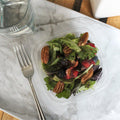 compostable 16 oz deli tub for small plates containing salad