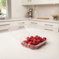 12 oz bioplastic produce container with fresh raspberries
